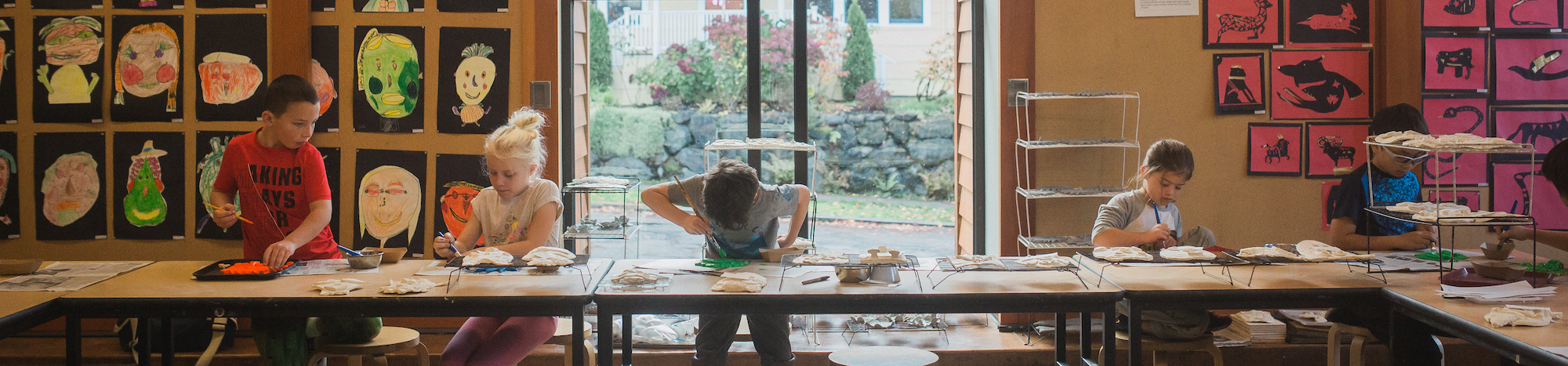 students doing art at a table