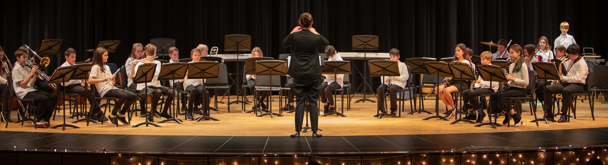 student orchestra and conductor