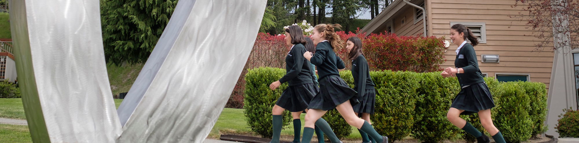 girls running outside in uniforms