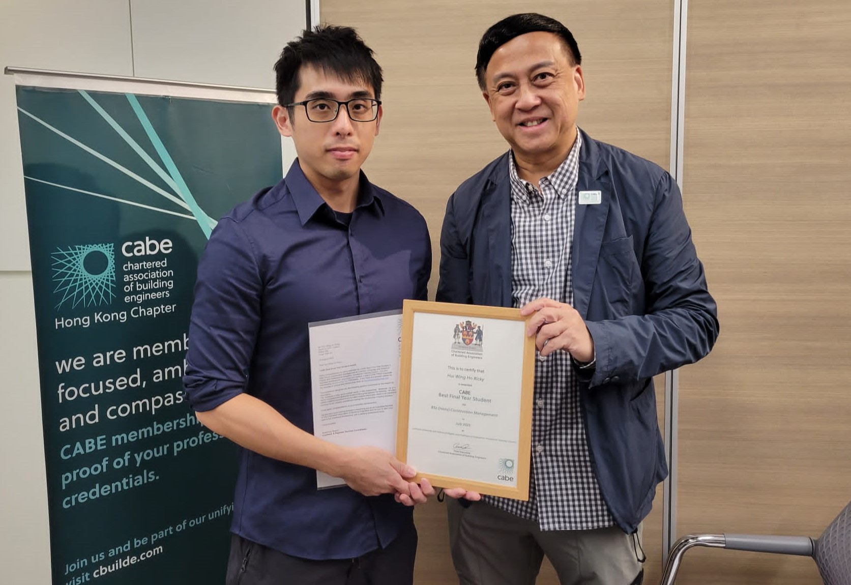 Mr Ricky HUI Wing Ho presented with his CABE Best Final Year Student Award by Hong Kong Chapter Chairman Mr Kyran Sze