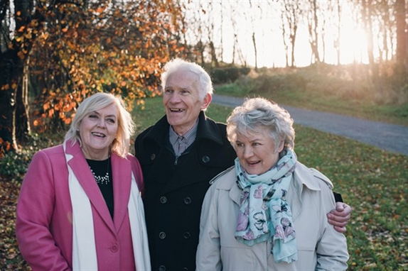 Tuam Survivors - three smiling people 