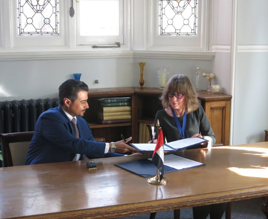 Professor Judy Broady-Preston, Immediate Past-President CILIP, and H.E Mr Ahmed Al Amri, President Sharjah Book Authority, sign an agreement to engage in activities on the digital agenda and shared knowledge infrastructure across the two regions