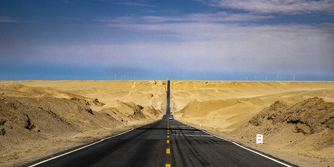 Photo of a road in a desert 