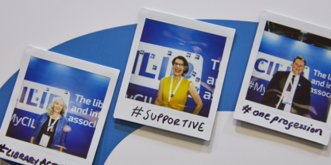 Photo from the 2019 CILIP Conference showing polaroid photos of CILIP members with the words they associate with CILIP which include suppotive, one profession and library activism