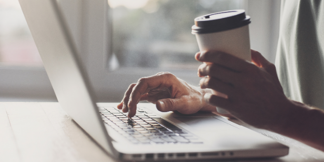 person typing on laptop