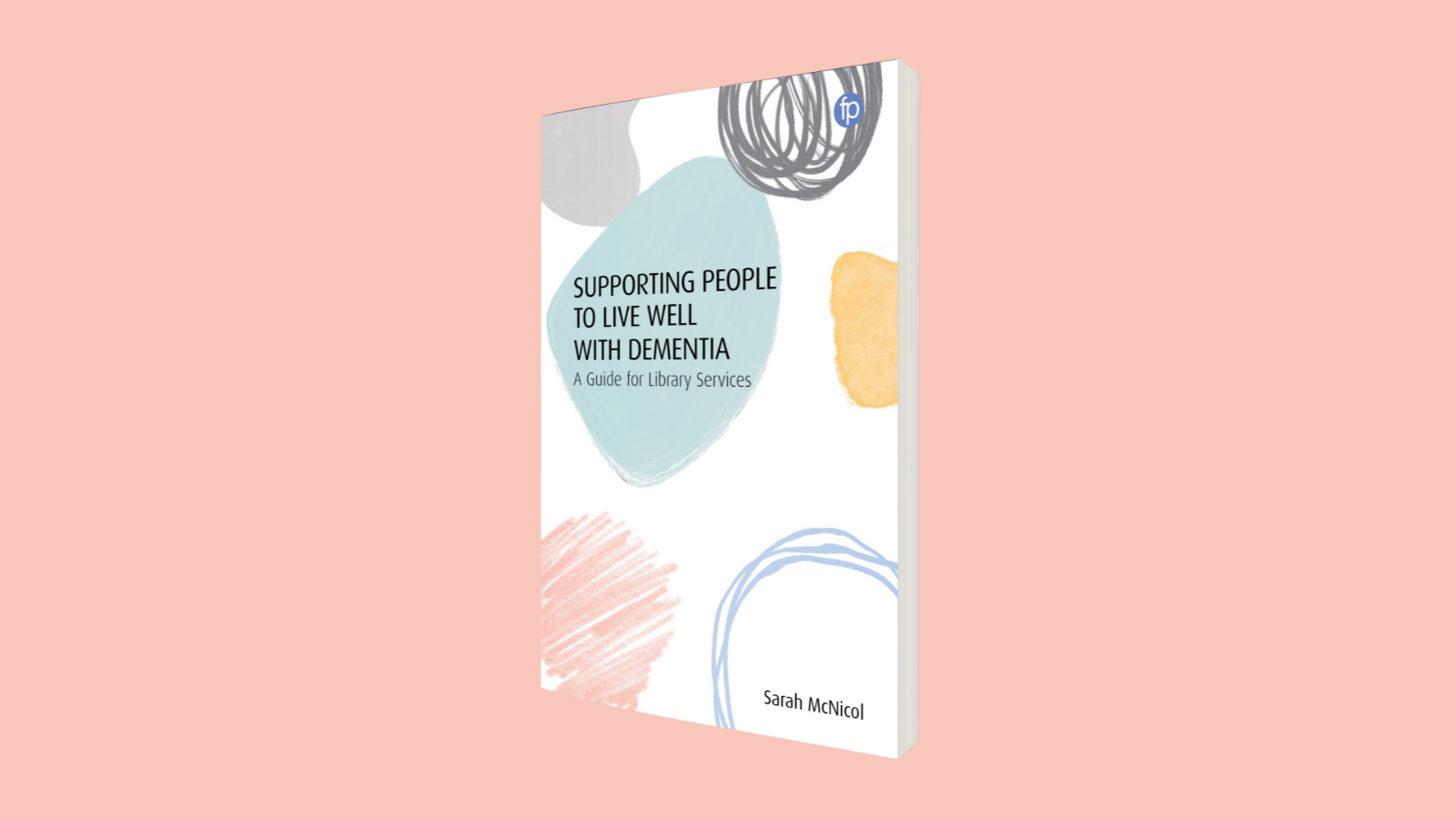 The book of Supporting People to Live Well with Dementia on a pink background 