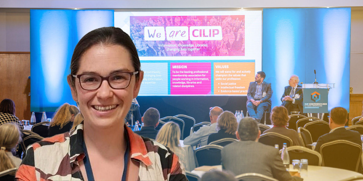 Photo of Alice Cann in front of CILIP conference 2023 