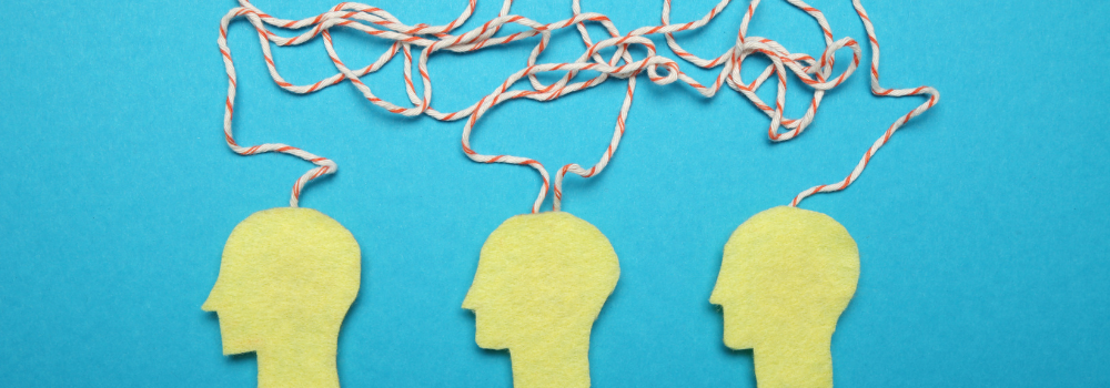 Illustration using felt of minds linked together with pieces of string