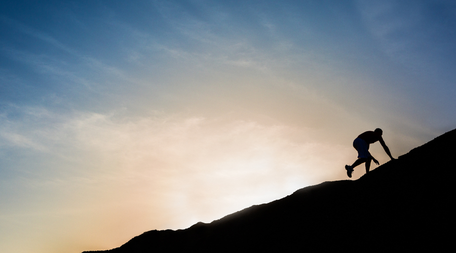 Person climbing a mountain