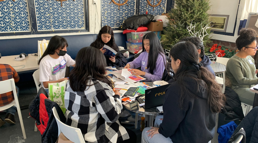 Students sitting around table
