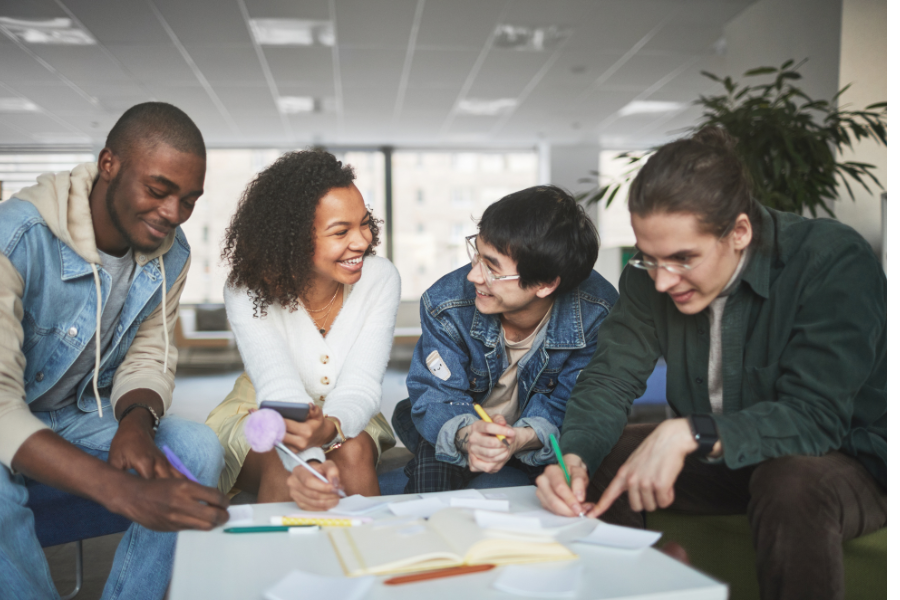 students talking around a table