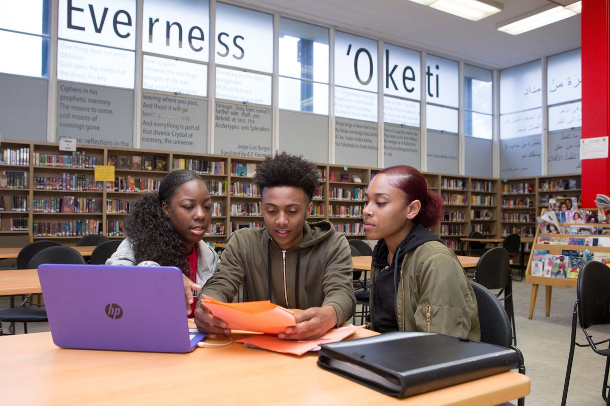 Students talking in a library