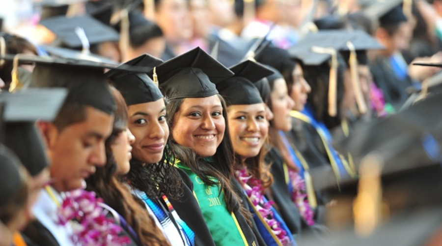 Latino/a students in graduation uniforms