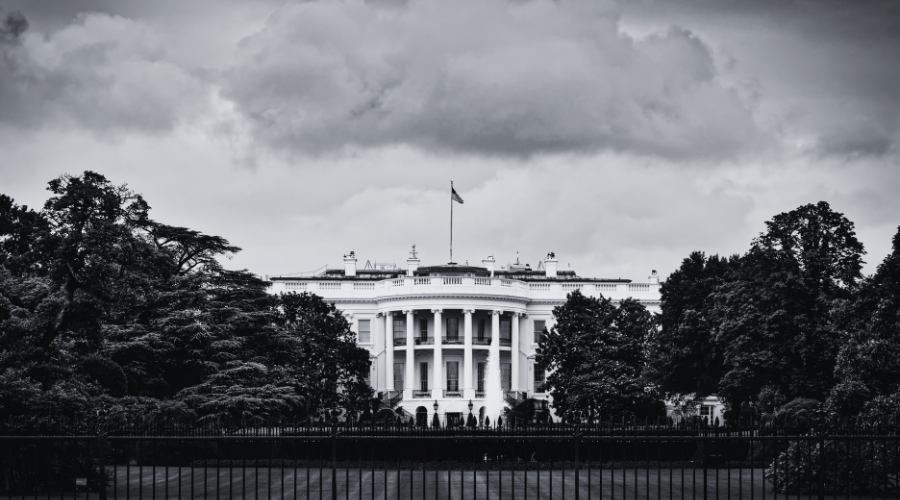 White house with storm clouds