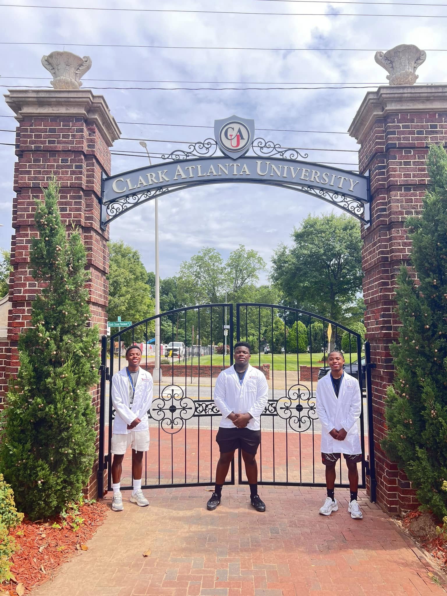 Three students at the gate for Clark Atlanta University