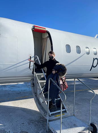 Rebecca Duclos alighting a plane