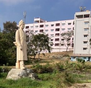 Statue and school building at S-VYASA
