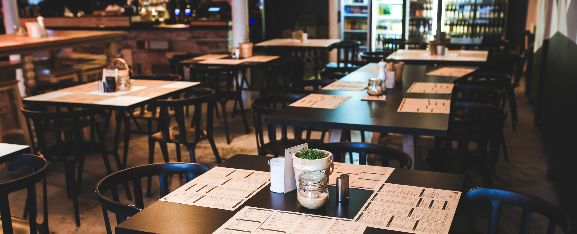Dining tables and chairs in an empty restaurant