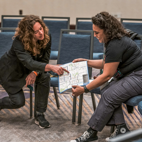 /Two faculty members reviewing a city map.