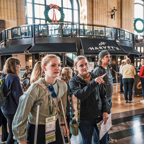 A group of students exploring Union Station as part of the 2024 City as Text explorations at the NCHC Annual Conference.