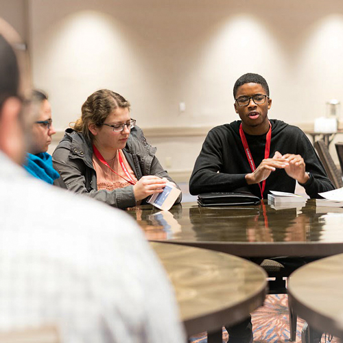 Group of students participating in the Student Fishbowl roundtable.