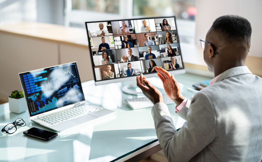 Photo of an African-American male professional attending a virtual meeting.