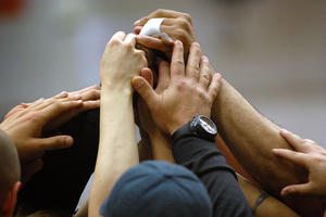 hands raised up together/