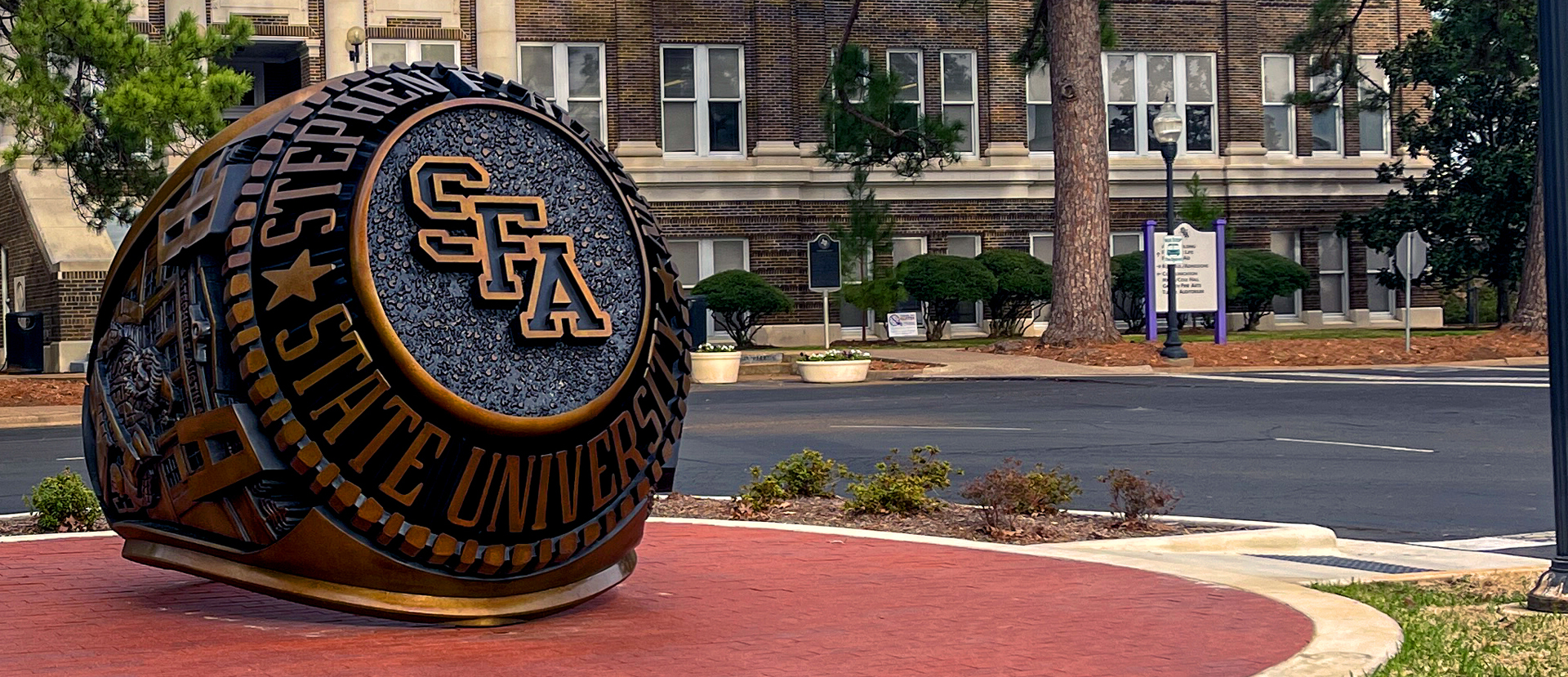 The SFA Ring Monument in front of the Austin Building