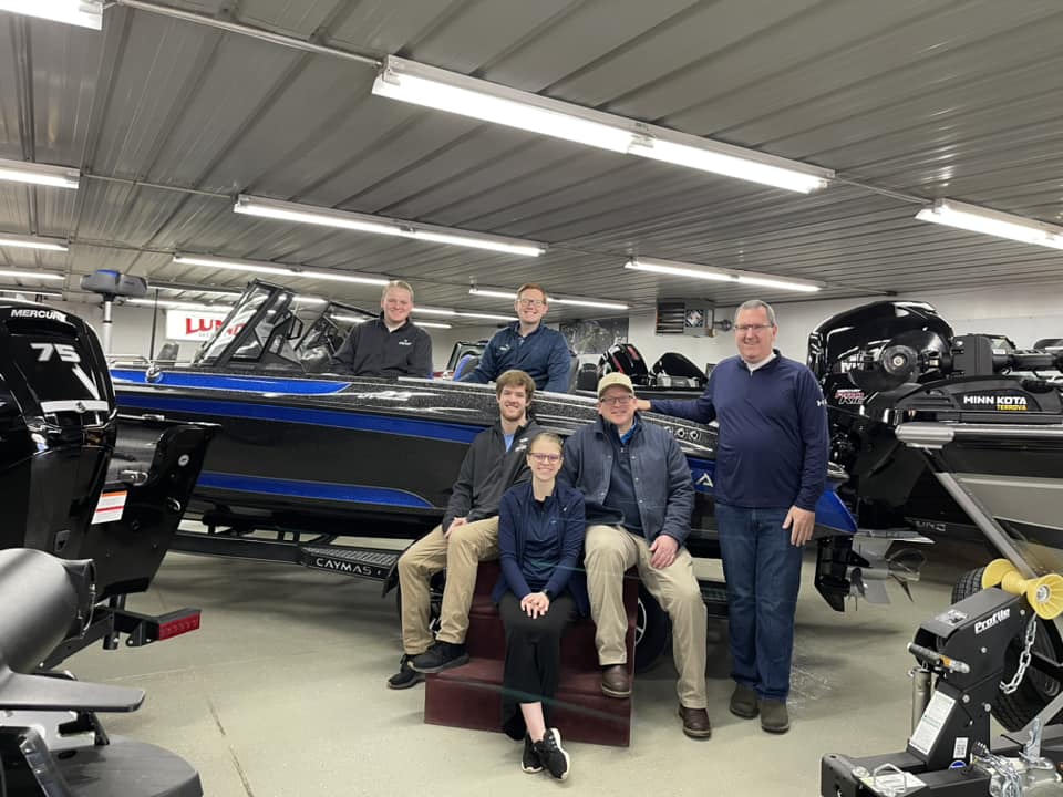 Group Photo with Boat