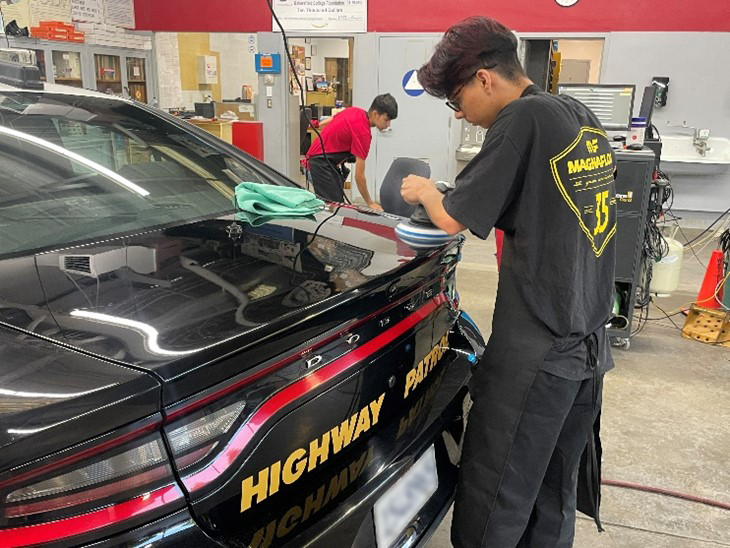 Photo of someone buffing a car at Bakersfield College