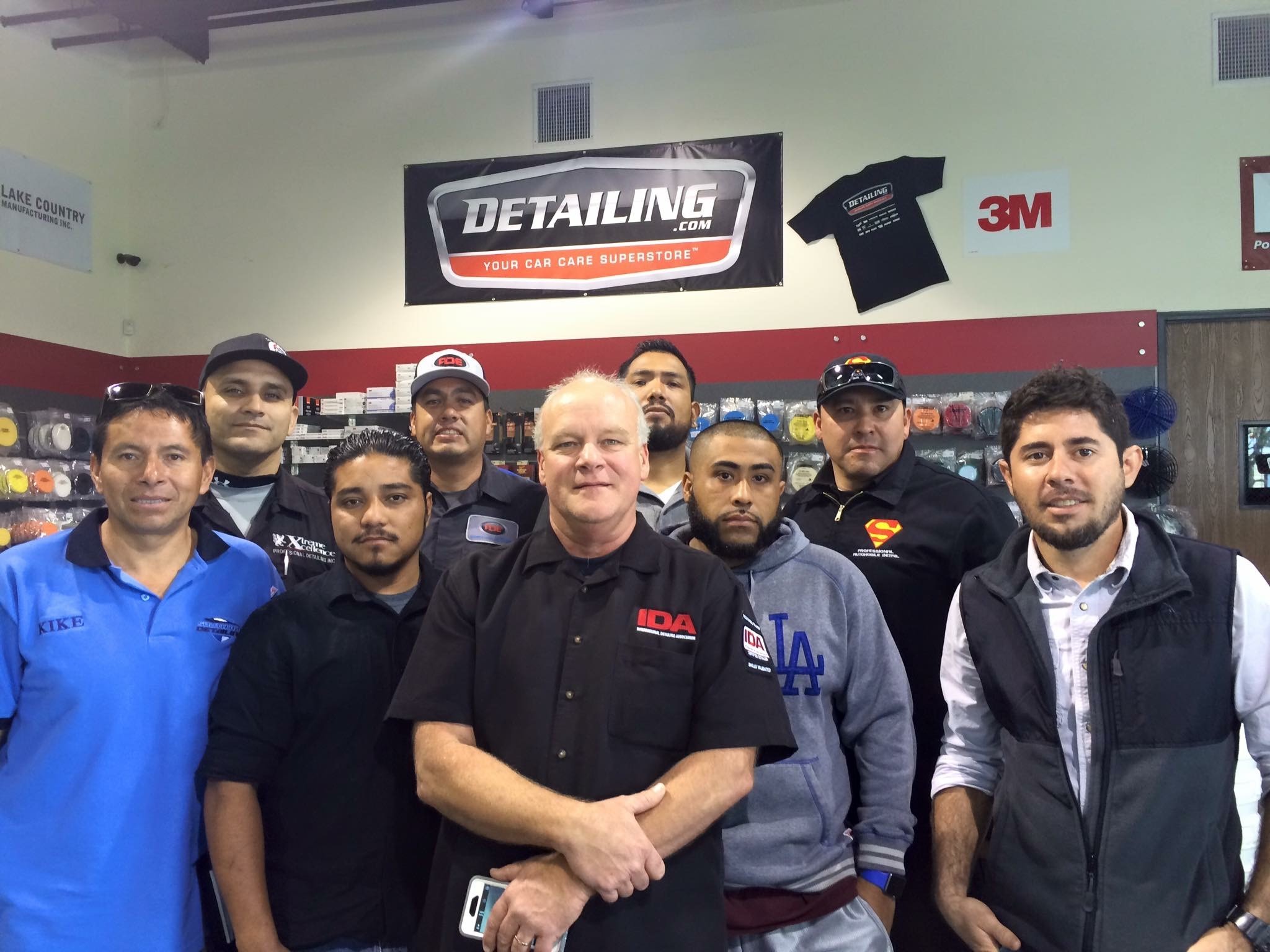 Group photo of St. Clair with detailers from the Latino community in Orange County