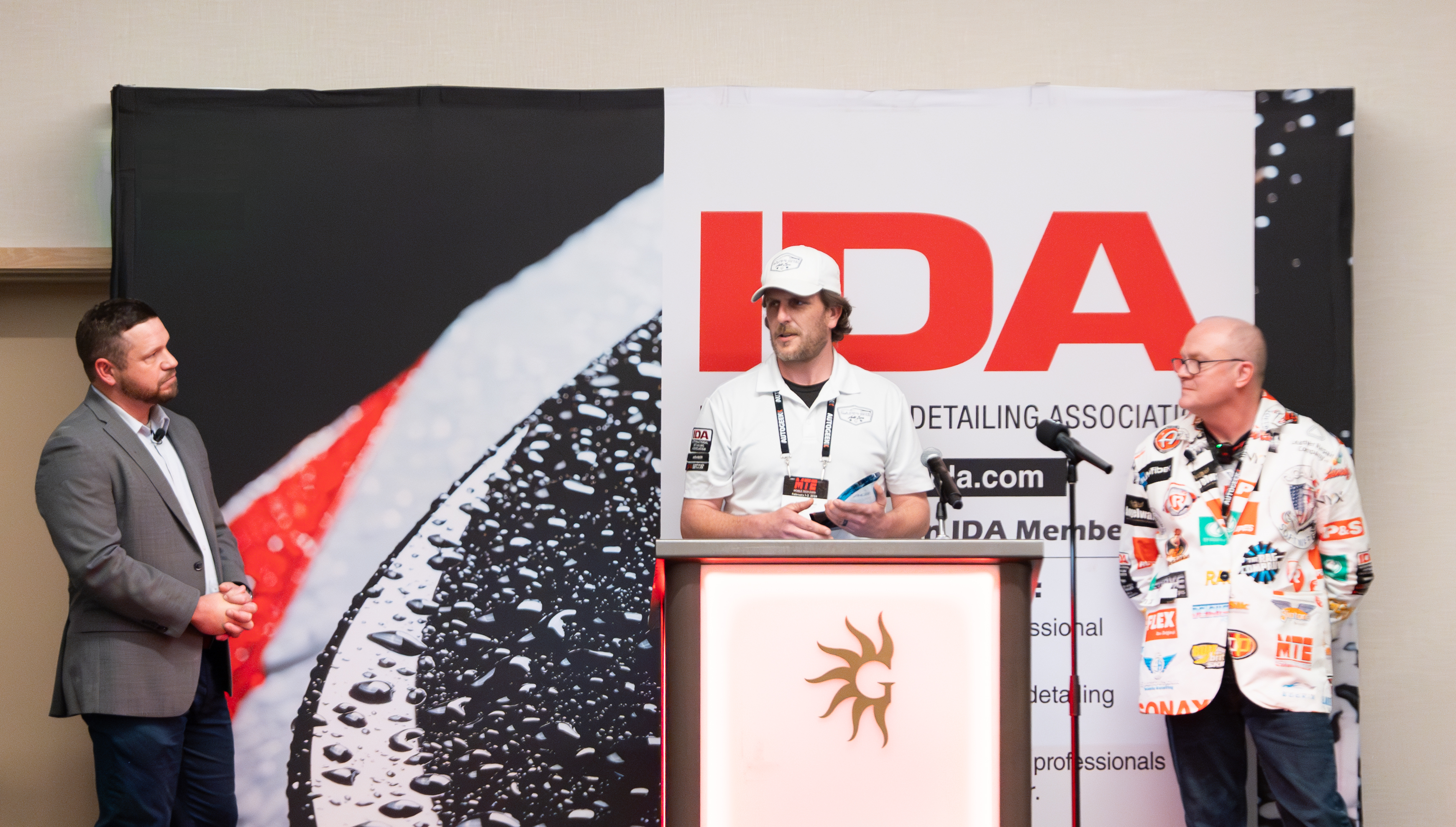 Dan Belair standing at the podium at MTE while he accepts his award