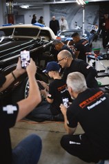 Rigo Santana (right) works with “Detail Kid” Stephen Thompson III (Left) at a detailing event at the Petersen Automotive Museum in March 2024.