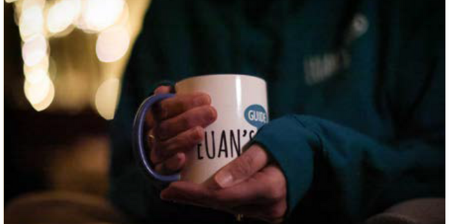 image of a man holding a mug