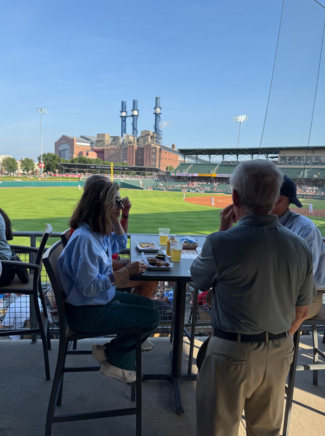 People chatting at ballgame